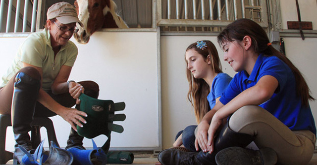 Two young people receiving instructions. Two young people receiving instructions.